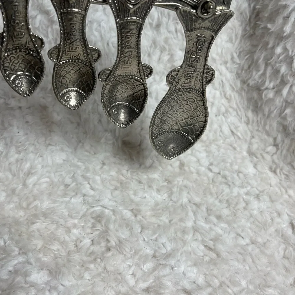 Vintage Tin Woodsman TWpewter set of four Fish measuring spoons with wall hanger